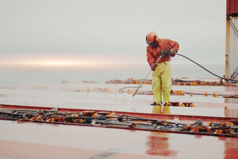 seaman seafarer welder safety protective clothes working with cutting grinding disk machine deck